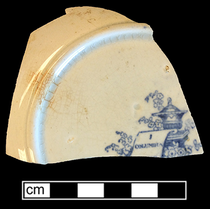 Printed underglaze refined white earthenware panelled cup with romantic motif pattern and continuous repeating linear border motif (interior) from 18BC27, Feature 30.  